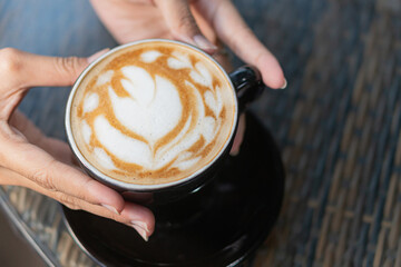 Beautiful Latte Art in a Black Cup