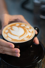 Beautiful Latte Art in a Black Cup