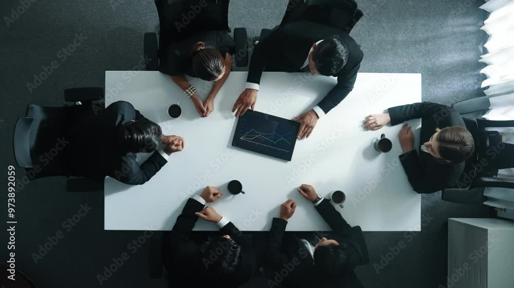 Aufkleber top down aerial view of group of business people looking at financial chart while analyze and explai