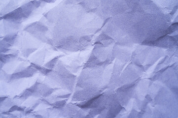 Obraz premium Full frame shot of crumpled purple paper sheet texture and background.