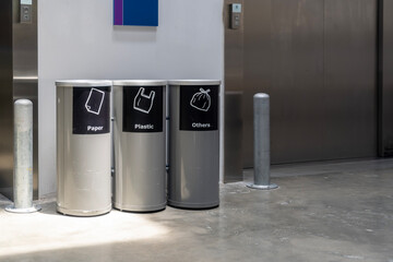 Modern Elevator Entrance with recycling bins in Commercial Building or mall