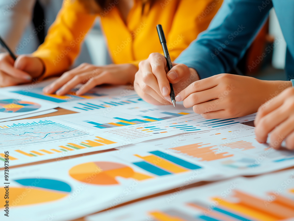 Poster hands of people analyzing colorful charts and graphs on paper.