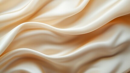 Obraz premium A soft beige background with a luxurious satin cloth in a flowing wave