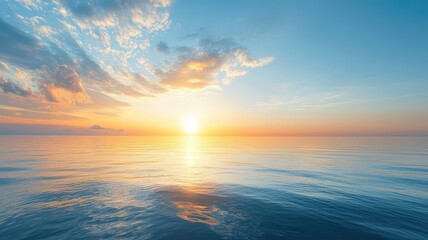 Naklejka premium A serene sunset over calm waters, showcasing vibrant colors in the sky reflecting on the tranquil sea surface.