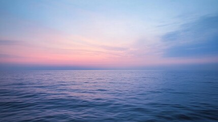 Fototapeta premium The calm before dusk, with a sky dimly lit by the last moments of daylight, soft pinks and blues mingling on the horizon.