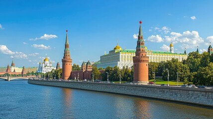 Captivating view of the Kremlin along the river, showcasing its iconic towers and beautiful architecture under a clear blue sky.