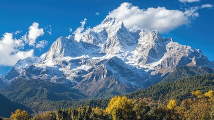 Fototapeta premium Majestic snow-capped mountain under a clear blue sky with lush greenery in the foreground, showcasing stunning natural beauty.