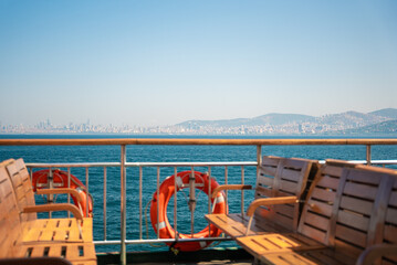  Sea of Marmara view from the ferry open deck over the railing with attached orange lifebuoys and...