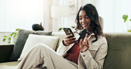 Budget, payment and woman with smartphone, credit card and economy with savings, investment and smile. House, person and girl on sofa, cellphone and transactions with ecommerce, app and financial