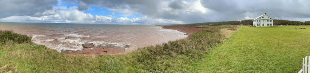 The Johnson Shore Inn overlooks a rugged coastline with dramatic cliffs and the vast ocean. The...