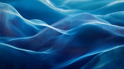 Obraz premium An abstract image depicting smooth, flowing blue waves with delicate textures, resembling fabric or water, creating a calm and serene atmosphere.