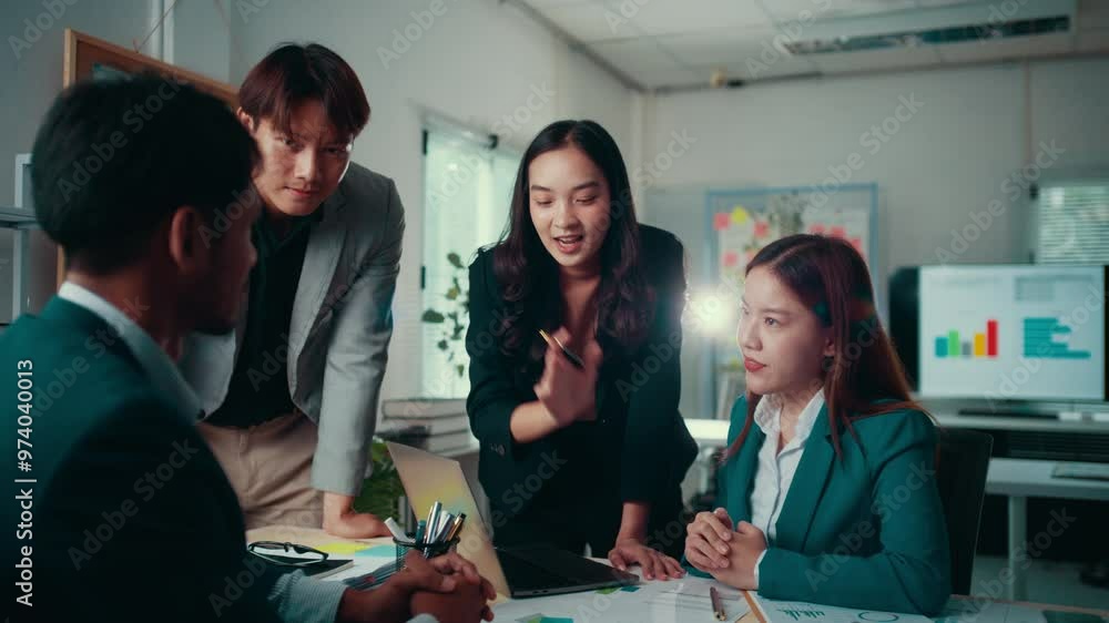 Aufkleber four asian businesspeople engage in a discussion within an office setting. collaborating on a projec