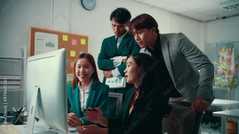 Aufkleber Team of four asian businesspeople is having a discussion while looking at a computer screen. They are analyzing data and collaborating on a project