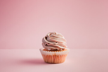 Single pink cupcake with frosting