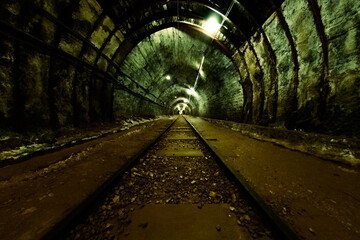 Mining train rails inside a salt mine in Khewra, Punjab, Pakistán