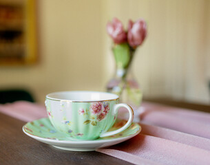 Pastel teacup on a pastel table setting