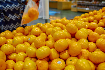 Lot of ripe orange in supermarket