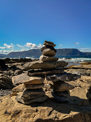 Inukshuk made of piled rocks on beach in Newfoundland, Canada.