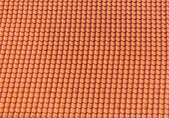 Red roof tiles of the house as an abstract background. Texture