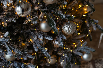 Christmas tree closeup-colorful decorations, lights and ornaments