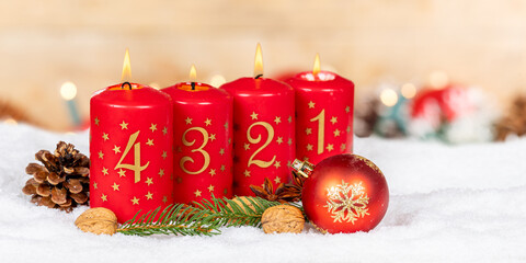 Fourth 4th Sunday in advent with burning candle Christmas time decoration panorama with copyspace...