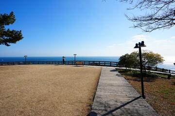 walkway and bench at seaside cliff