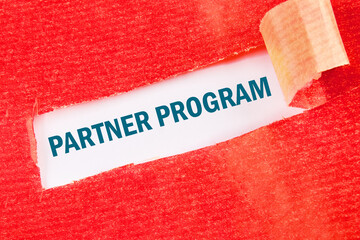 Conceptual partner program symbol. Copy space. on a white background under a torn strip of paper