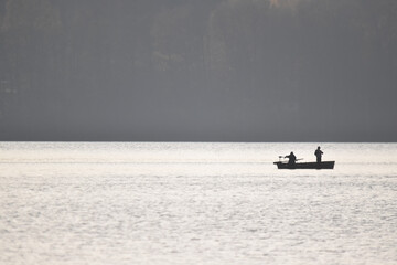 Fishermen catching fish from a boat
