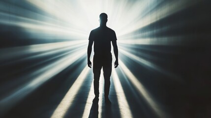 Fototapeta premium Dramatic silhouette of a man against intense light, creating elongated shadows and emotional impact