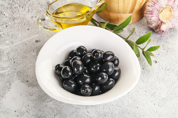 Black olives with oil and branch
