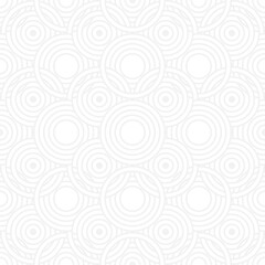 Seamless trend ornament of circles and arcs, geometric white shapes for textiles and wallpaper. Abstract panoramic pattern on a gray background for a New Year or wedding cover or card.