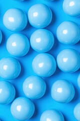 seamless pattern of shiny blue spheres on blue background