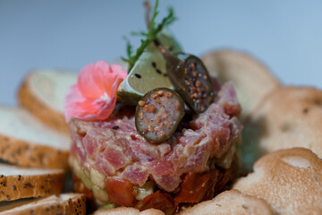 Exquisite Gourmet Tuna Tartare with Artisan Bread and Elegant Garnishes