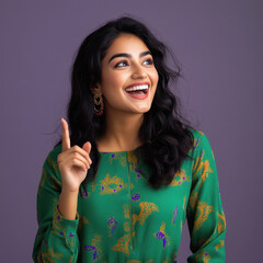 Fototapeta premium young beautiful woman pointing finger up side