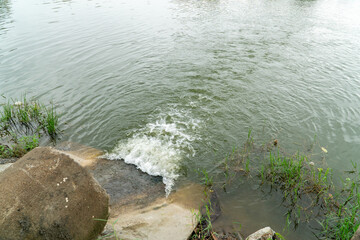 Road culvert in the rainy. Water runoff after rain
