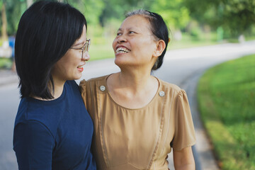 Obraz premium Young Asian woman with her mother in the park