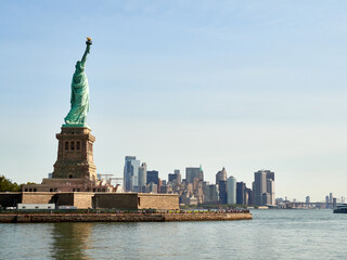 Fototapeta premium The Statue of Liberty Enlightening the World. Usa National Monument. Recognized as a universal symbol of freedom and democracy. National Park Service.