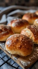 Freshly baked rolls cooling on a wooden rack in a cozy kitchen with warm lighting during early evening hours