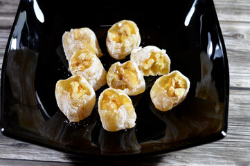 Arabian Egyptian taffy stuffed with walnuts, Eastern candy made as a celebration of the prophet's Mohamed birthday in Egypt, Arabian and Islamic country, traditional Arabian candy of Mawled El Nabawi