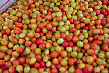 Fresh ripe tomatoes sold in a supermarket. Fresh red tomatoes, Red tomatoes background