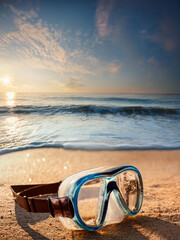 swimming goggles on the beach