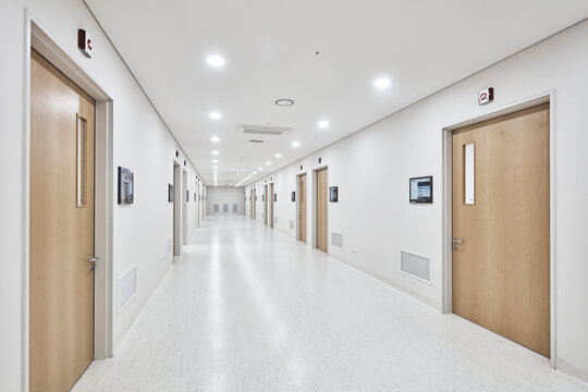 Bright Hospital Corridor with Doors, Clean Healthcare Interior