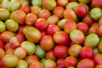 Fresh ripe tomatoes sold in a supermarket. Fresh red tomatoes, Red tomatoes background