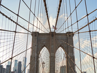 Brooklyn Bridge, connects the boroughs of Manhattan and Brooklyn in New York City. It is a historic symbol of New York and a fundamental part of the city, as it crosses the East River connecting Manha