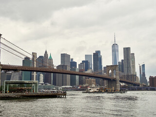 Brooklyn Bridge, connects the boroughs of Manhattan and Brooklyn in New York City. It is a historic symbol of New York and a fundamental part of the city, as it crosses the East River connecting Manha
