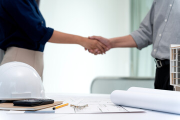 Architects or engineers hand shake to agree on the project