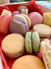 colorful macaroons on wooden table