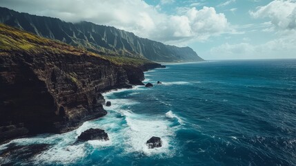 Obraz premium Scenic view of Hawaii's rugged coastline with crashing waves and rocky cliffs