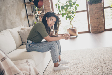 Photo of pretty sad lady wear casual t-shirt feeling bad sitting couch indoors room home house