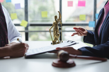Female lawyer or judge consulting or discussing contract documents with clients Introduce correct...